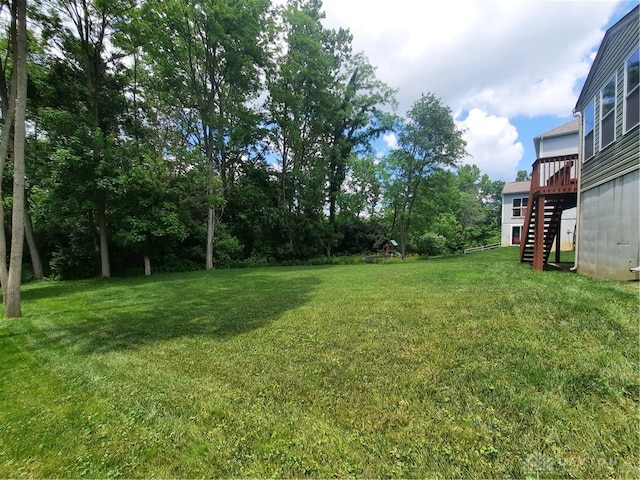 view of yard featuring a wooden deck