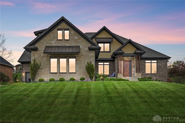 view of front of property with a lawn