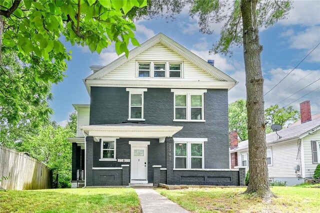 front facade with a front lawn