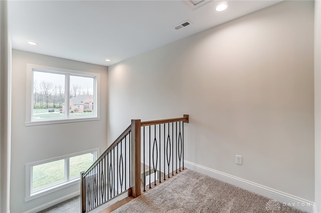 stairway with carpet floors