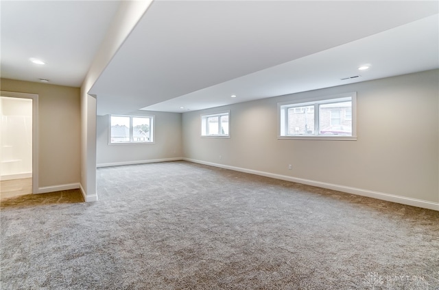 basement with light colored carpet