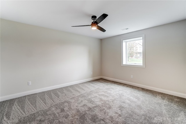 empty room featuring carpet flooring and ceiling fan