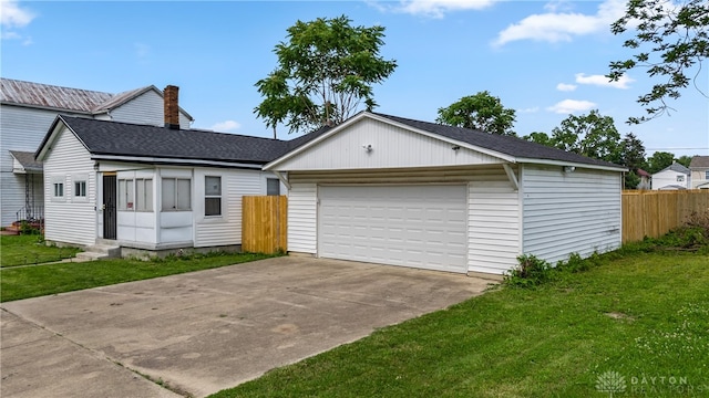 single story home with a garage and a front yard