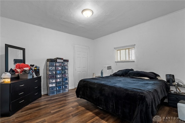 bedroom with dark wood-type flooring