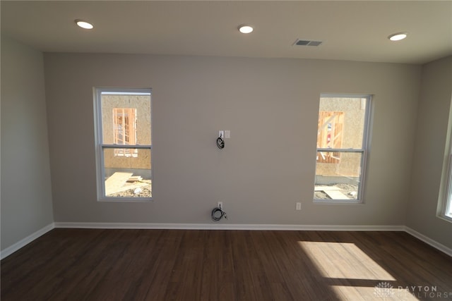 empty room with dark hardwood / wood-style floors