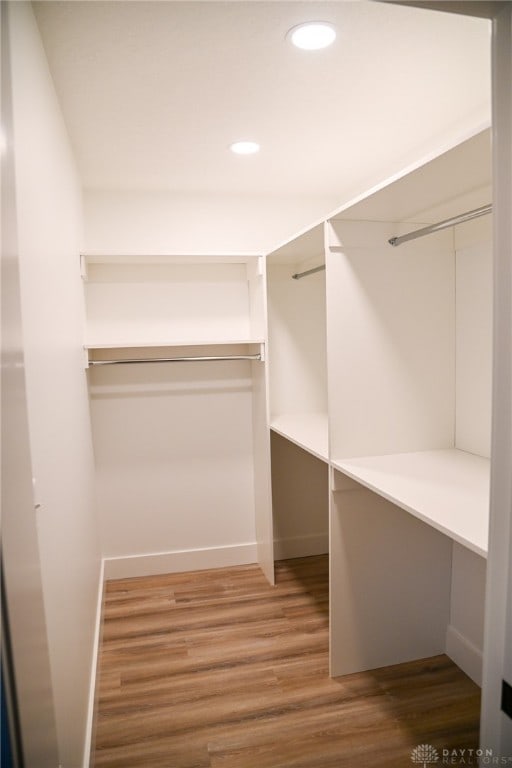 walk in closet featuring hardwood / wood-style floors