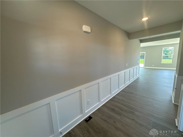 corridor featuring dark hardwood / wood-style flooring