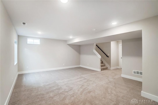 basement with light colored carpet