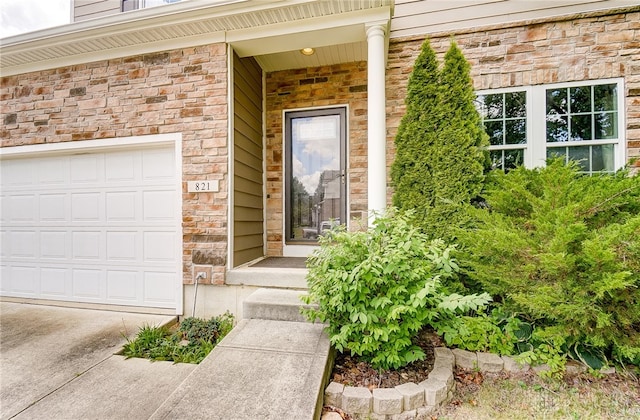 entrance to property featuring a garage