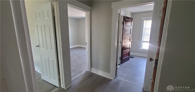 hall with dark hardwood / wood-style flooring