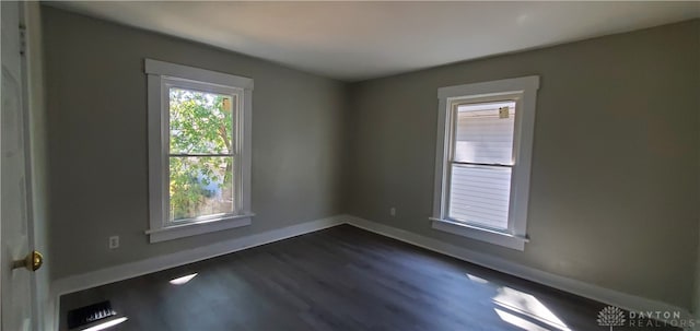 empty room featuring dark hardwood / wood-style floors