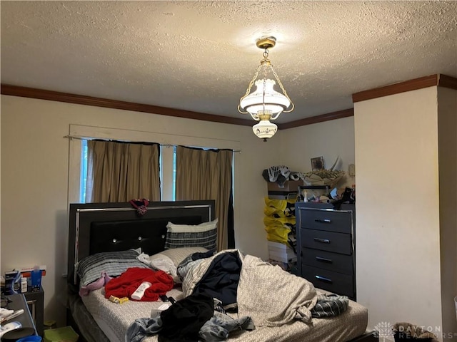 bedroom with crown molding and a textured ceiling