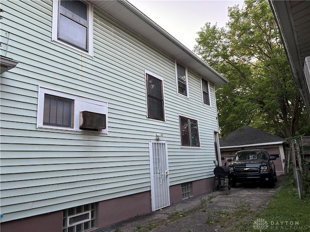 view of side of property featuring a garage