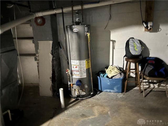 utility room featuring water heater