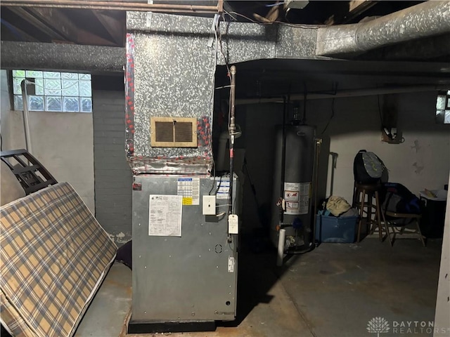 utility room featuring gas water heater