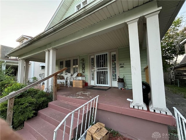 entrance to property featuring covered porch