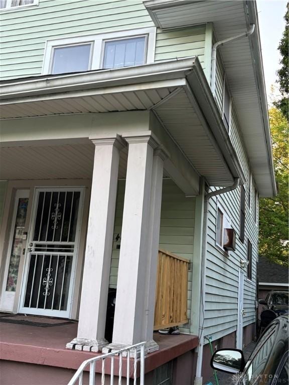 view of property exterior featuring a porch