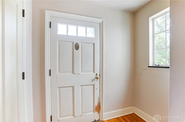 doorway with light wood-type flooring