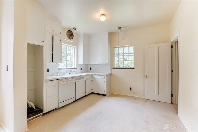 kitchen with sink, white cabinetry, and dishwasher