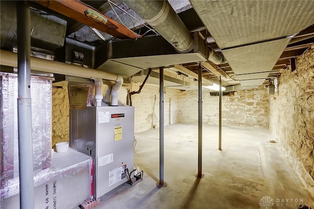 basement featuring heating unit