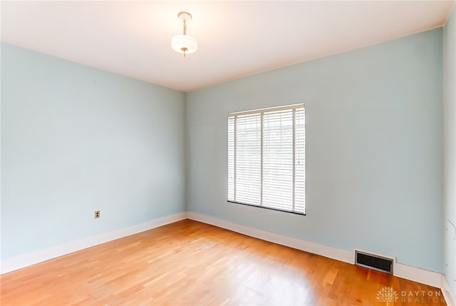 spare room featuring hardwood / wood-style flooring