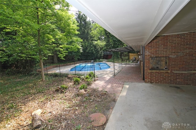 view of swimming pool featuring a patio area