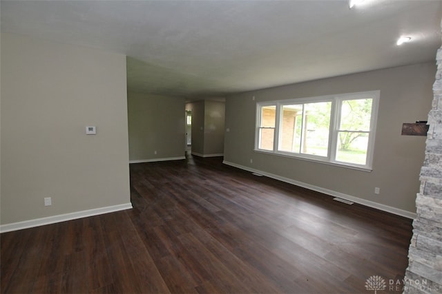 unfurnished room featuring dark hardwood / wood-style flooring