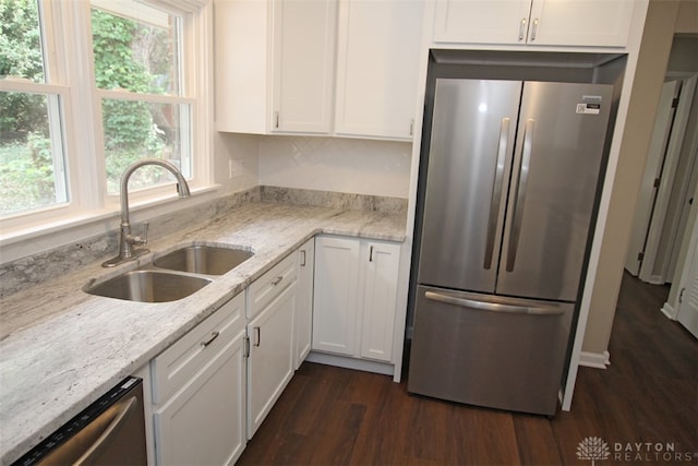 kitchen featuring sink, white cabinetry, stainless steel appliances, and dark wood-type flooring