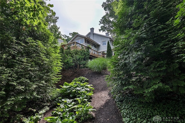 view of side of home featuring a deck