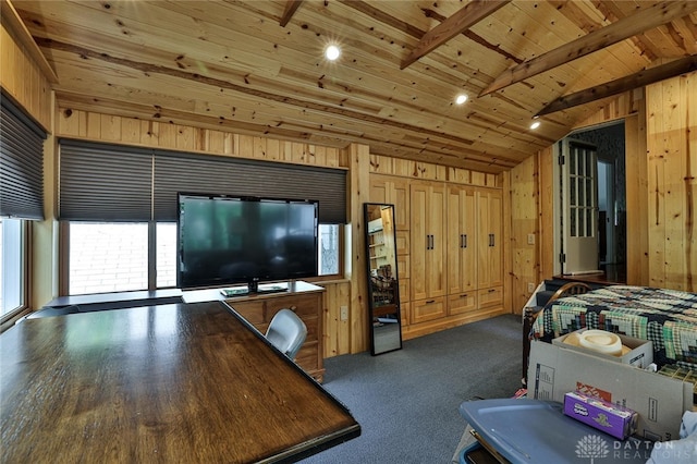 bedroom with lofted ceiling with beams, wood ceiling, and wood walls