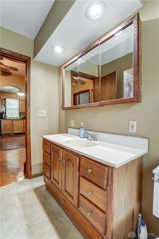 bathroom with tile patterned flooring and vanity