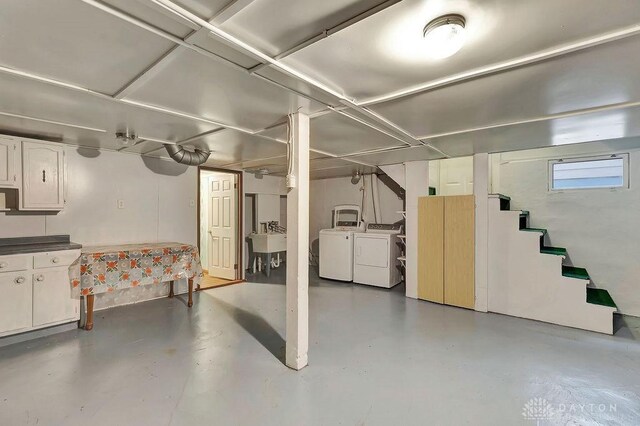 basement with sink and independent washer and dryer