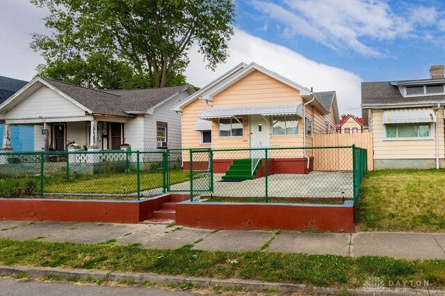 bungalow with a front lawn