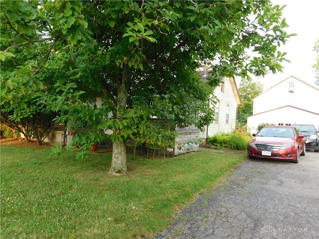 exterior space with a front lawn and a garage