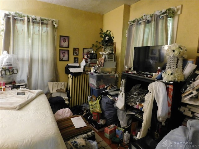 bedroom with radiator heating unit