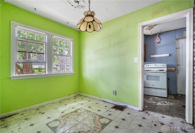 unfurnished dining area featuring tile patterned floors