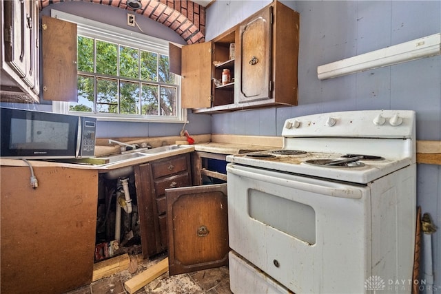 kitchen with range hood, light tile patterned floors, and electric stove