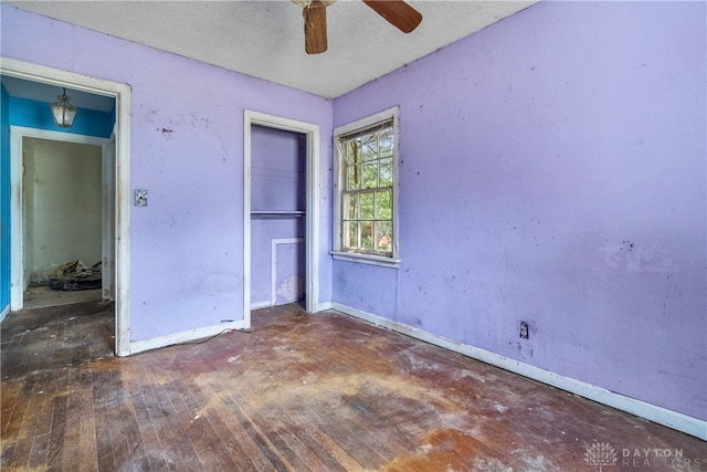 unfurnished bedroom featuring a textured ceiling, ceiling fan, and hardwood / wood-style floors