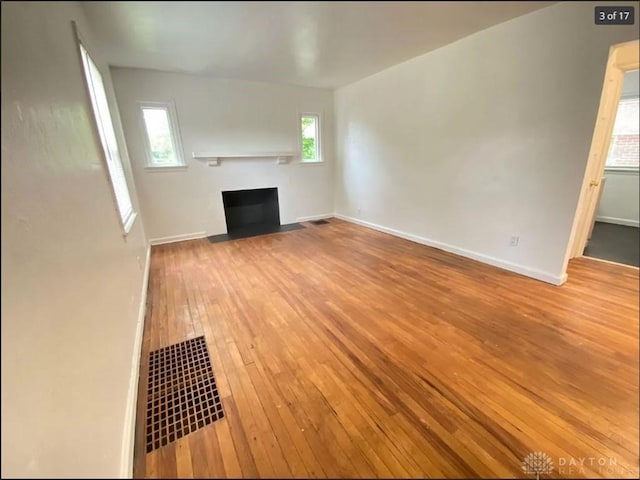 unfurnished living room with light hardwood / wood-style floors