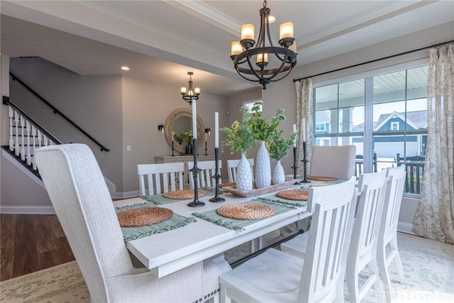 dining room featuring hardwood / wood-style flooring and an inviting chandelier