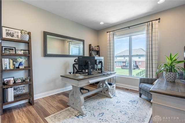 office space with dark hardwood / wood-style floors