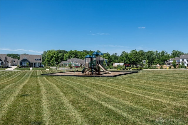 view of jungle gym with a lawn