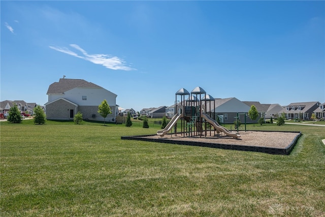 view of jungle gym featuring a lawn