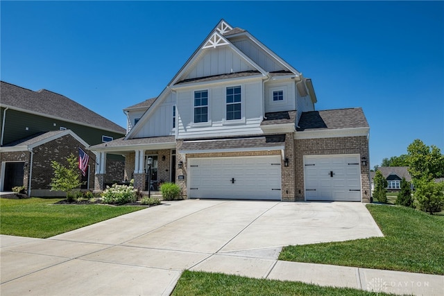 craftsman inspired home with a front yard, a porch, and a garage