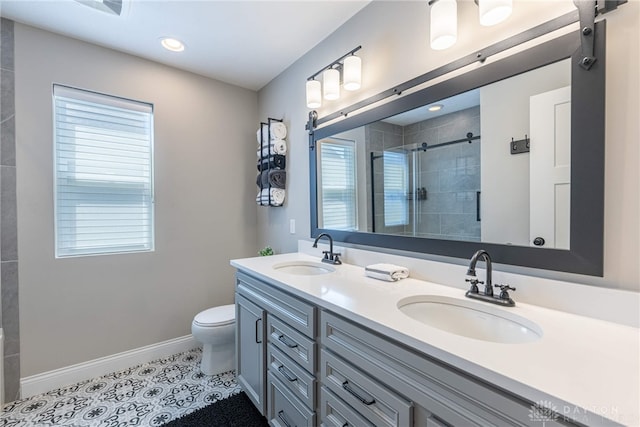 bathroom with toilet, a shower with door, tile patterned floors, and plenty of natural light