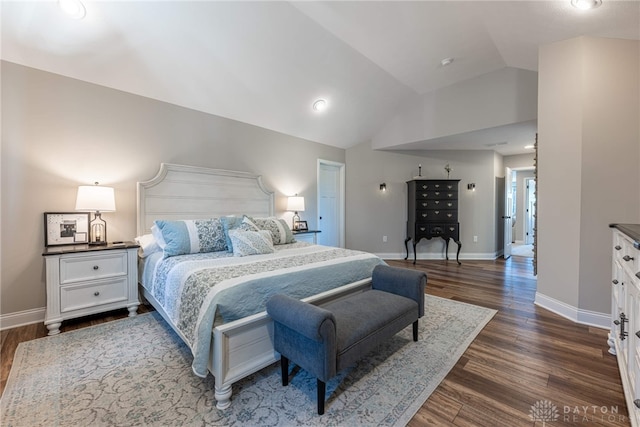 bedroom with dark hardwood / wood-style flooring and vaulted ceiling