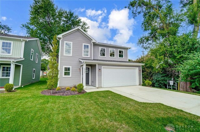 front of property featuring a garage and a front lawn