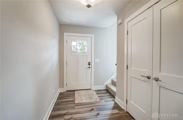 doorway to outside featuring dark hardwood / wood-style flooring