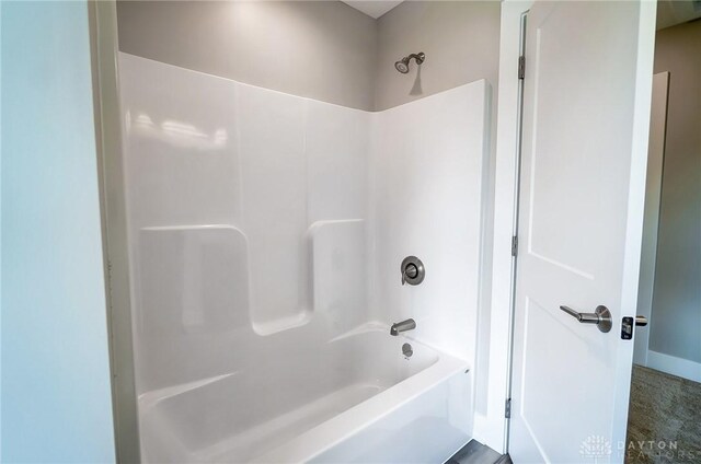 bathroom featuring  shower combination