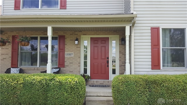 doorway to property with a porch